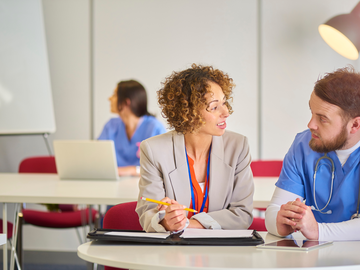 Pharmacist talking to a customer