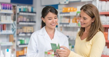 Pharmacist talking to a customer
