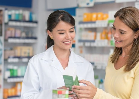 Pharmacist talking to a customer