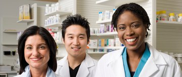A photo of three pharamcists smiling