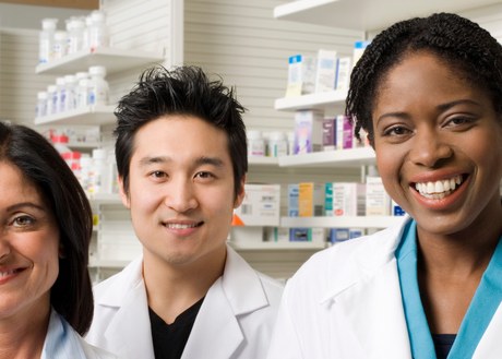 A photo of three pharamcists smiling