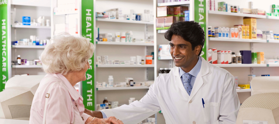Pharmacist talking to patient