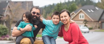 photo of children, mother and father of Indigenous ethnicity outdoors