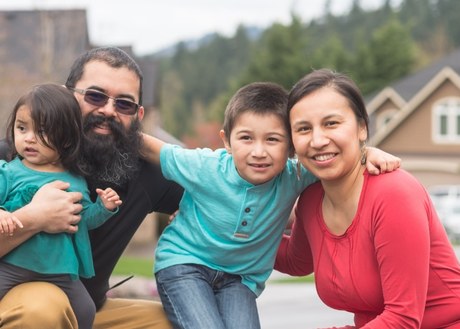 photo of children, mother and father of Indigenous ethnicity outdoors